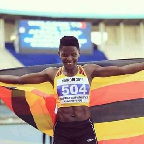 Jennifer spreading the Uganda flag with joy after winning a race